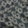 Bol Kesim Jakarlı Çelenk Desenli Denim Pantolon